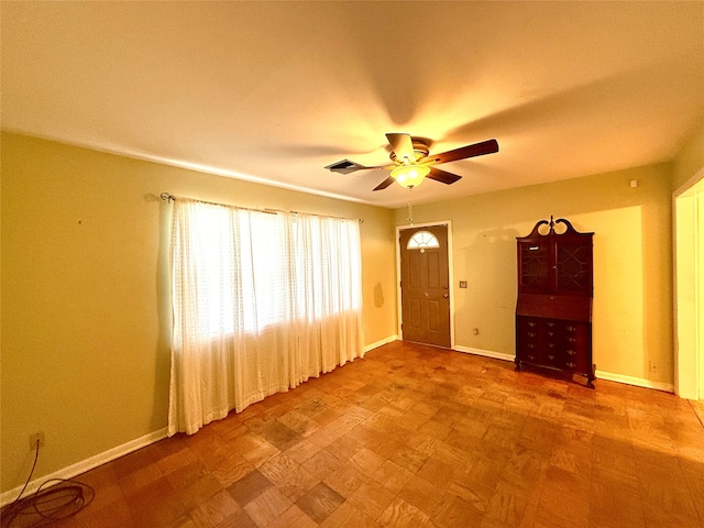 unfurnished room featuring ceiling fan