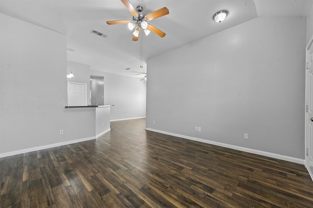 unfurnished living room featuring lofted ceiling, dark hardwood / wood-style floors, ceiling fan, and sink