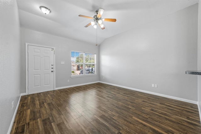 unfurnished room with dark hardwood / wood-style flooring, ceiling fan, and vaulted ceiling