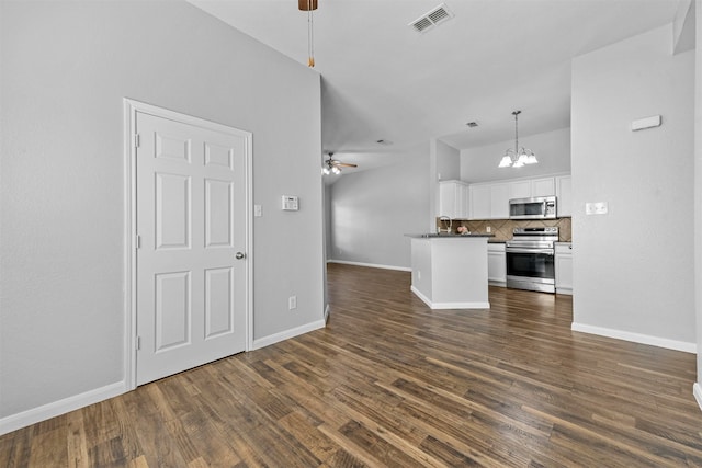 unfurnished living room featuring ceiling fan with notable chandelier and dark hardwood / wood-style flooring