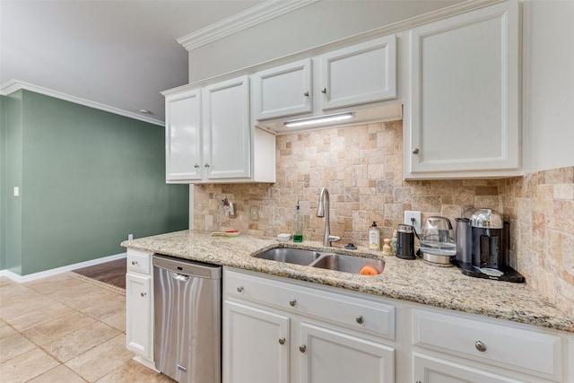 kitchen with crown molding, tasteful backsplash, sink, and stainless steel dishwasher