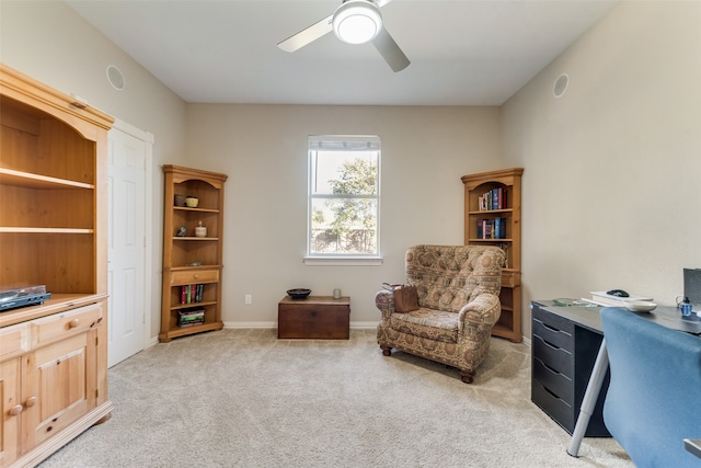 office space featuring light colored carpet and ceiling fan