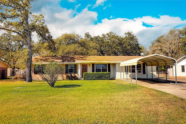 ranch-style house with a front yard and a carport