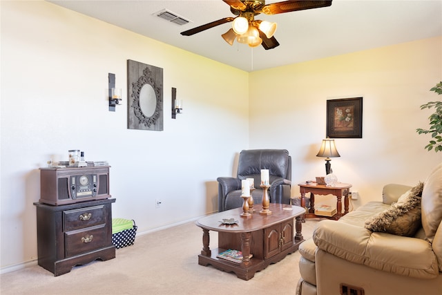 sitting room with light colored carpet and ceiling fan