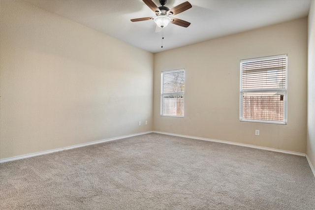 empty room with carpet flooring and ceiling fan