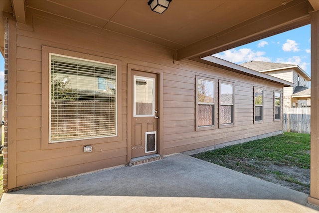 property entrance with a patio area