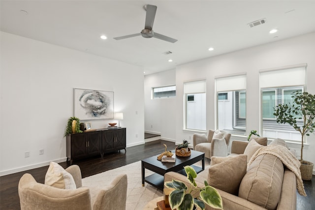 living room featuring hardwood / wood-style floors and ceiling fan