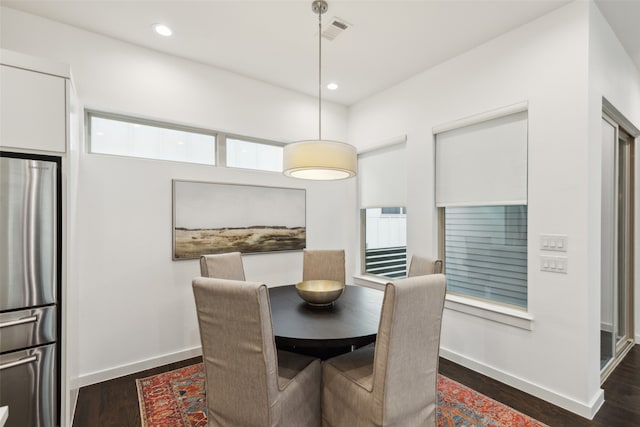 dining space with dark wood-type flooring