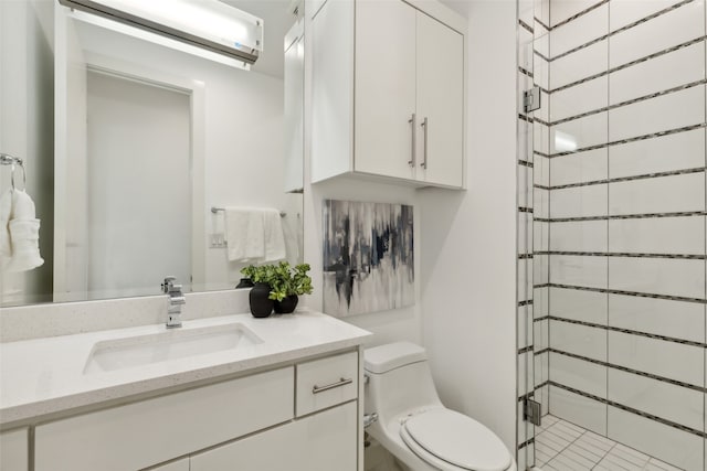 bathroom featuring toilet, an AC wall unit, vanity, an enclosed shower, and tile patterned flooring