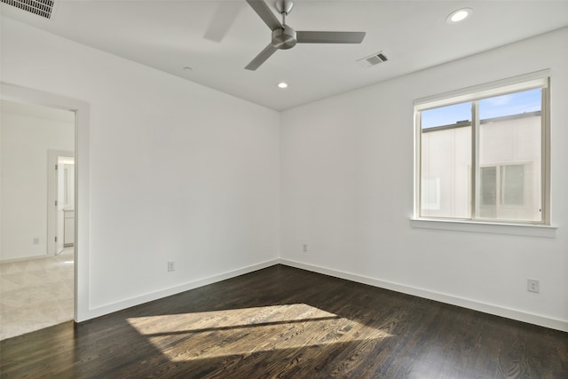 unfurnished room featuring ceiling fan and dark hardwood / wood-style flooring