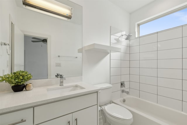 full bathroom featuring vanity, tiled shower / bath combo, a wall mounted AC, and toilet