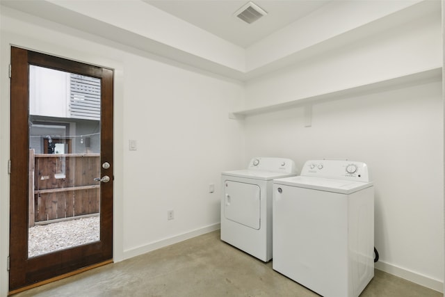 washroom featuring washing machine and dryer