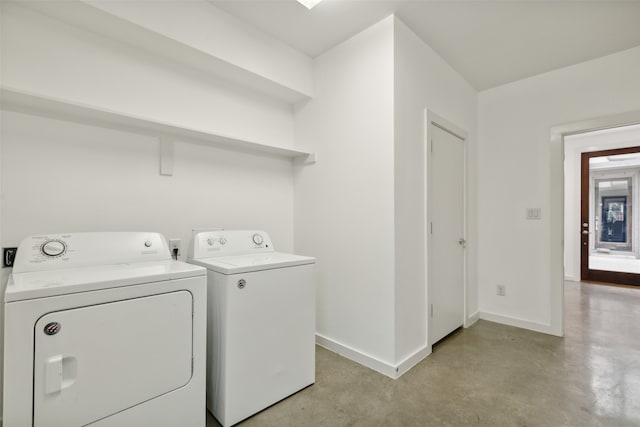 washroom with independent washer and dryer