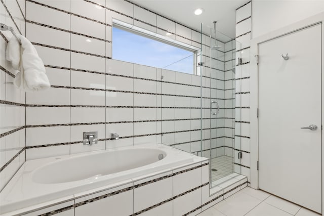 bathroom with tile patterned flooring and plus walk in shower