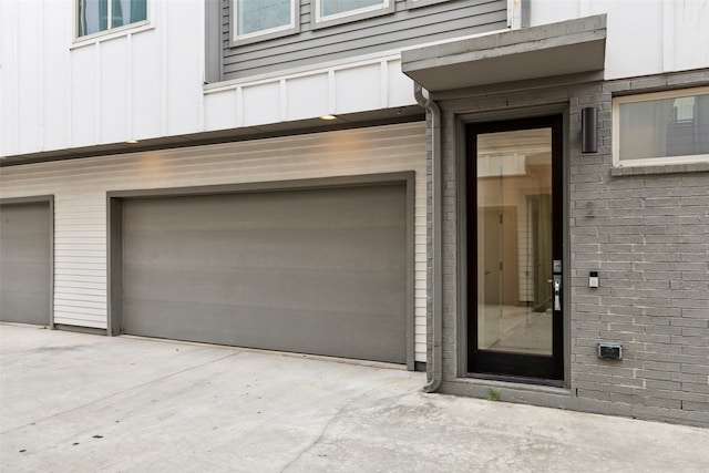 doorway to property featuring a garage