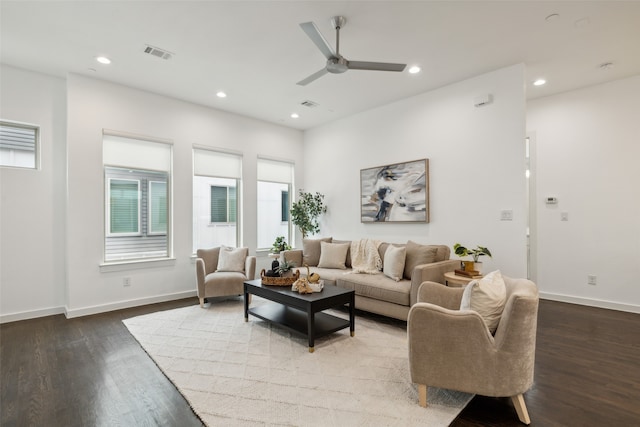 living room with hardwood / wood-style flooring and ceiling fan