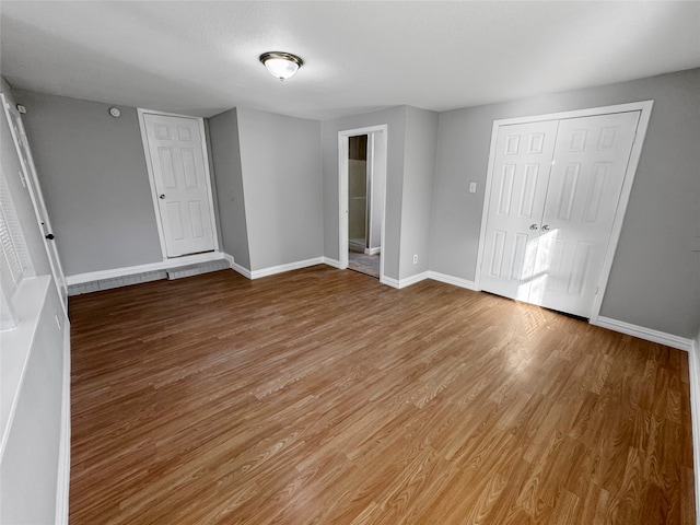 unfurnished bedroom featuring hardwood / wood-style floors