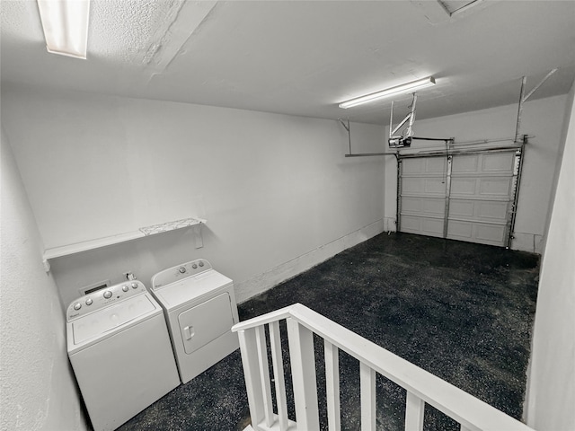 clothes washing area featuring independent washer and dryer