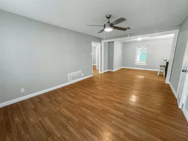 unfurnished bedroom with ceiling fan and hardwood / wood-style flooring