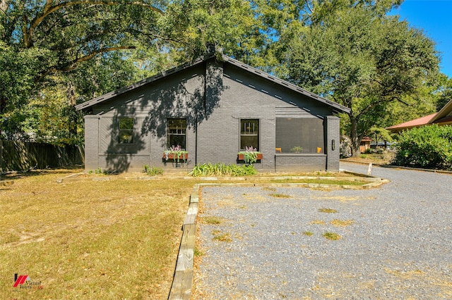 view of home's exterior featuring a lawn