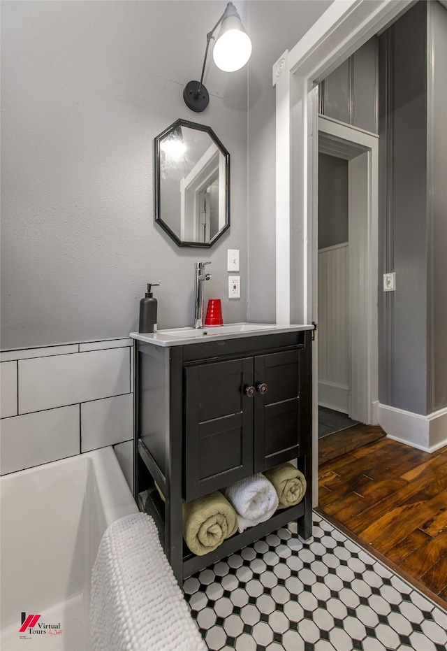 bathroom featuring vanity and wood-type flooring