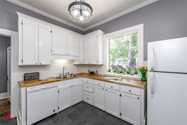 kitchen featuring butcher block counters, ornamental molding, sink, white cabinets, and white appliances