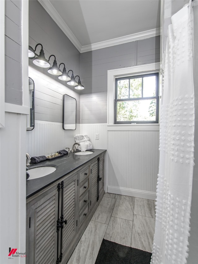 bathroom featuring vanity and ornamental molding