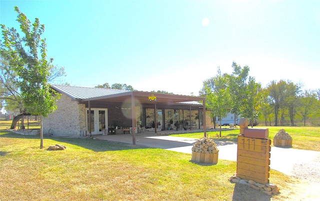 exterior space with a yard and a patio