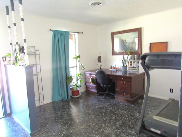 home office with a textured ceiling