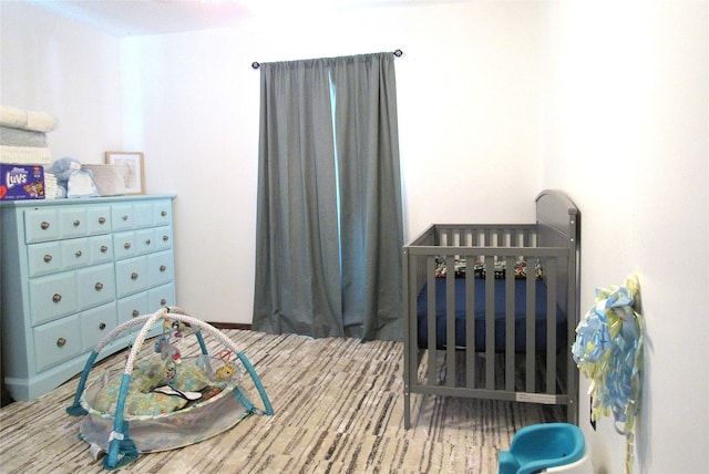 bedroom with a nursery area