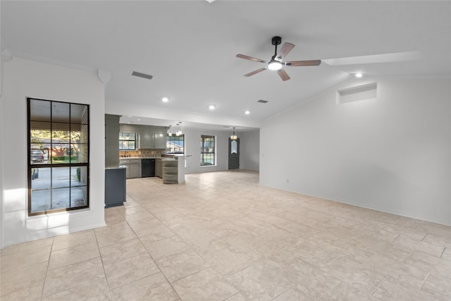 unfurnished living room with crown molding, light tile patterned floors, vaulted ceiling, and ceiling fan