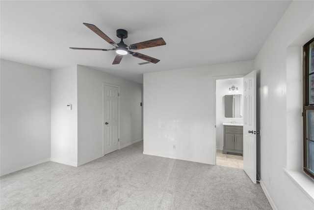 unfurnished room with light carpet and ceiling fan