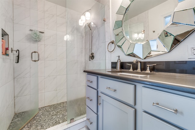 bathroom with vanity and walk in shower