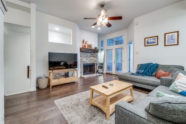 living room with a fireplace, ceiling fan, hardwood / wood-style floors, and french doors