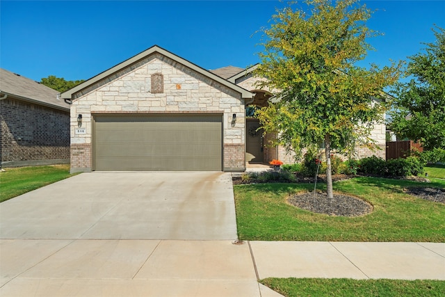 view of front of house featuring a front lawn and a garage