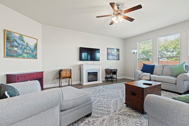 living room featuring light hardwood / wood-style floors and ceiling fan