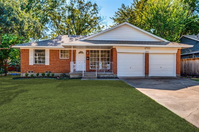 single story home featuring a front yard, covered porch, and a garage