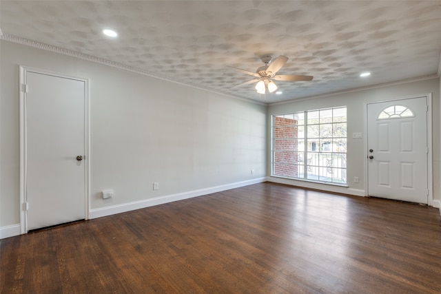 foyer entrance with ornamental molding, ceiling fan, and dark hardwood / wood-style flooring