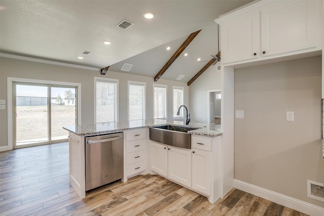 kitchen with sink, vaulted ceiling with beams, kitchen peninsula, stainless steel dishwasher, and white cabinets