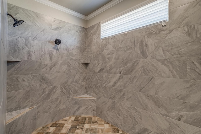 bathroom with a tile shower and ornamental molding