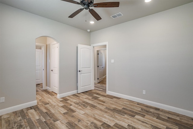 unfurnished bedroom with light hardwood / wood-style floors and ceiling fan