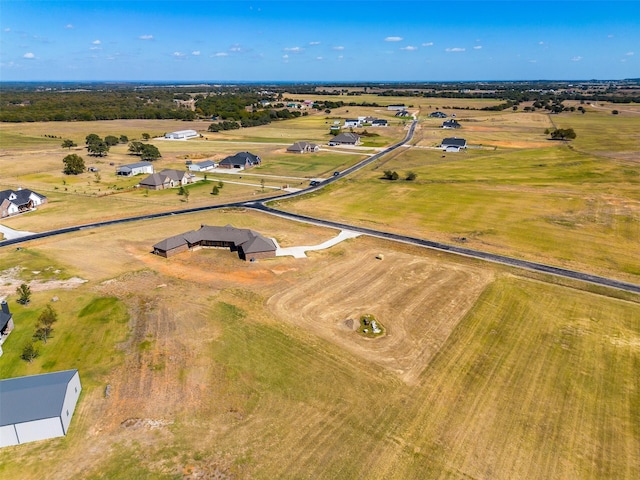 birds eye view of property featuring a rural view