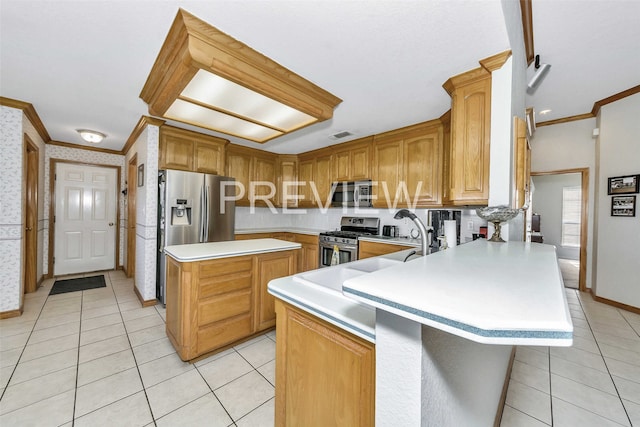 kitchen featuring a kitchen island, crown molding, light tile patterned floors, and stainless steel appliances