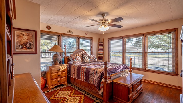 bedroom featuring ceiling fan and dark hardwood / wood-style flooring