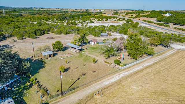 birds eye view of property with a rural view