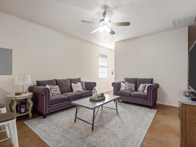 living room featuring electric panel, carpet flooring, a textured ceiling, and ceiling fan