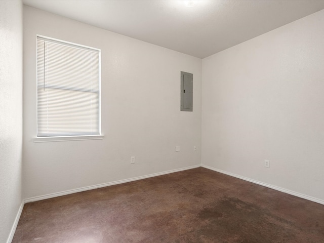 spare room with electric panel and dark colored carpet