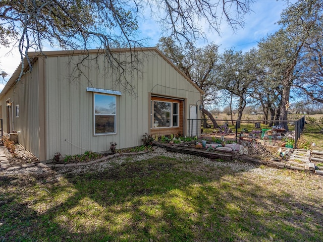 view of side of home featuring a yard