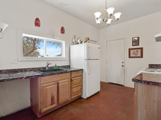 kitchen featuring sink, white fridge, decorative light fixtures, and an inviting chandelier