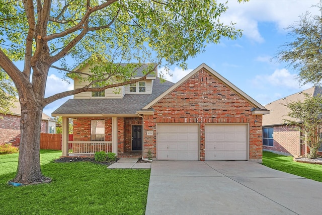 view of front property featuring covered porch, a garage, and a front lawn